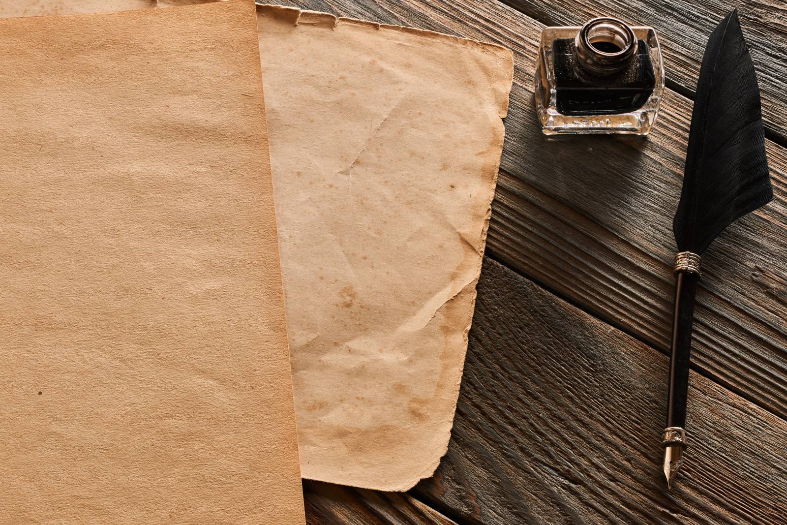 Aged paper and a writing quill