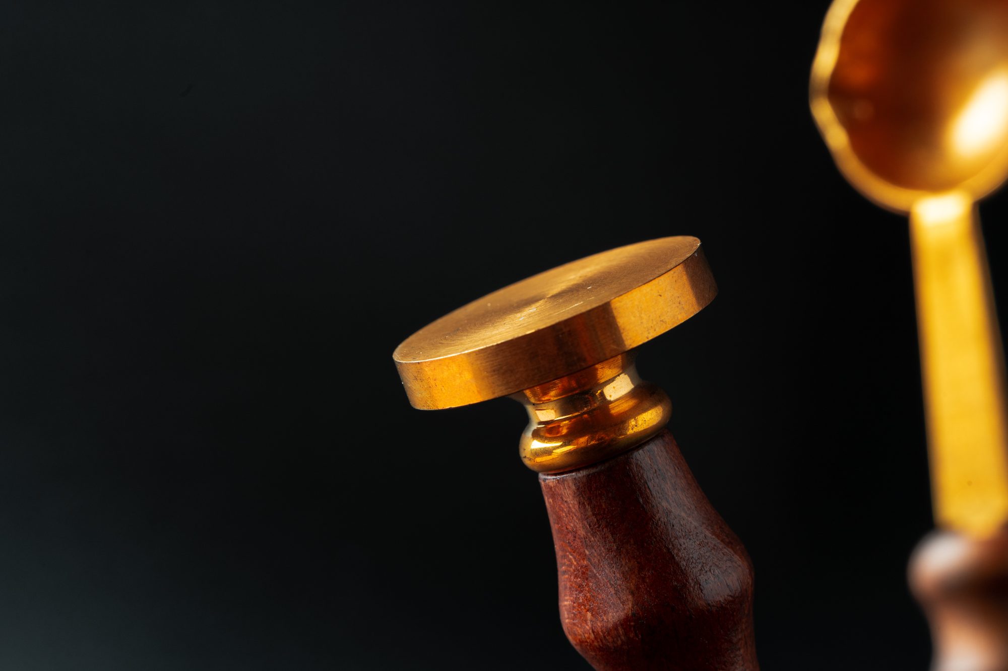 A gold seal on a dark background